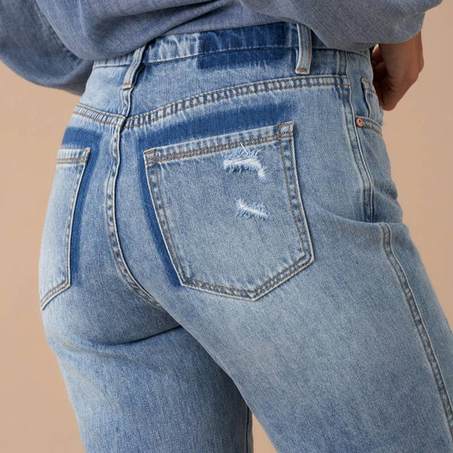 Distressed back pocket denim
